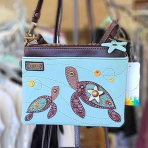 turquoise handbag with mother and baby turtle motif